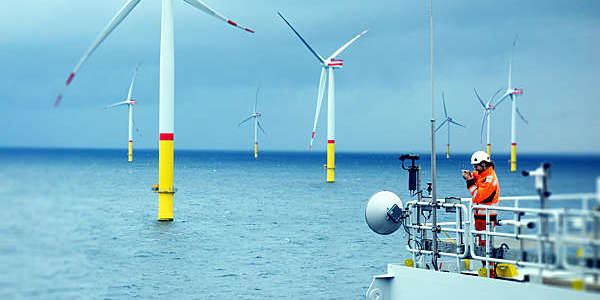 An electrician monitors the telecommunication system at an offshore wind farm.