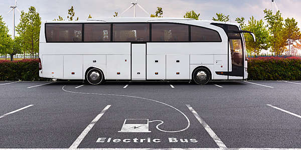 Electric bus on charge using pure energy from wind turbines.